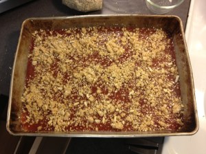 A little crumb is sprinkled on top of the jam, thus completing the sandwich.