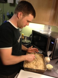 Sam gently mixes the crumble... but not too much.