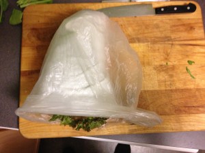 Put the paper towel-wrapped veg into a plastic bag. Twist the top closed. 