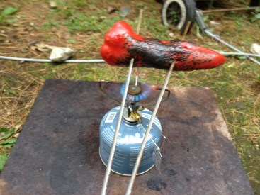 Roasting Chiles over the camp stove. Underneath the stove is the slab of marble that Sam uses in the oven when he bakes bread. It was a great work surface, but it's NEVER coming camping with us...