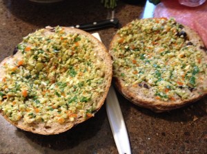 Step 1: Make olive tapenade. In a food processor, combine 3 cloves garlic, 12 oz pimento stuffed olives (drained), parsley, and olive oil. Process until chunky. Cut bread in half and hollow out the top to make more room for sandwich. Spread 2/3 tapenade onto top and bottom of bread.